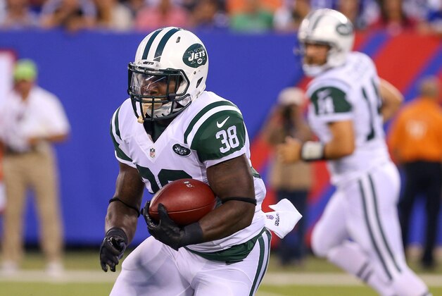 Aug 29, 2015; East Rutherford, NJ, USA;  New York Jets running back Zac Stacy (38) runs with the ball during the first half of their game against the New York Giants at MetLife Stadium. Mandatory Credit: Ed Mulholland-USA TODAY Sports