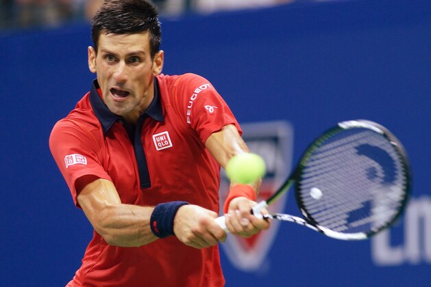 Novak Djokovic of Serbia hits a return to Andreas Haider-Maurer of Austria during their US Open 2015 second round men's singles match at the USTA Billie Jean King National Center September 2, 2015  in New York. AFP PHOTO/DON EMMERT        (Photo credit should read DON EMMERT/AFP/Getty Images)