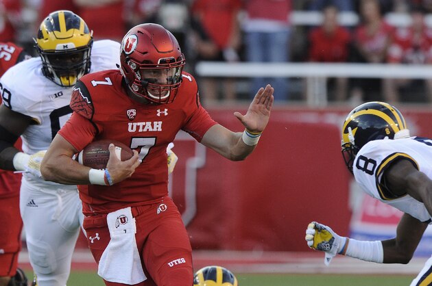 SALT LAKE CITY, UT - SEPTEMBER 3: Quarterback Travis Wilson #7 of the Utah Utes runs for a first down against the Michigan Wolverines at  Rice-Eccles Stadium on September 3, 2015 in Salt Lake City, Utah. (Photo by Gene Sweeney Jr/Getty Images)