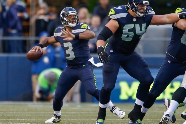 SEATTLE, WA - SEPTEMBER 03:  Quarterback Russell Wilson #3 of the Seattle Seahawks throws a 63 yard touchdown pass to wide receiver Tyler Lockett in the first quarter against the Oakland Raiders at CenturyLink Field on September 3, 2015 in Seattle, Washington.  (Photo by Otto Greule Jr/Getty Images)