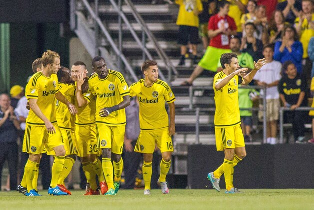 Aug 22, 2015; Columbus, OH, USA;  Columbus Crew SC forward Jack McInerney (30) celebrates his goal with his teammates in the second half of the game against the Sporting KC at MAPFRE Stadium. Columbus Crew SC beat Sporting KC by the score of 3-2. Mandatory Credit: Trevor Ruszkowski-USA TODAY Sports