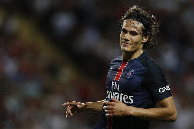 Paris Saint-Germain's Uruguayan forward Edinson Cavani celebrates after scoring his second goal during the French L1 football match Monaco (ASM) vs Paris Saint-Germain (PSG), on August 30, 2015 at the Louis II stadium in Monaco.       AFP PHOTO / VALERY HACHE        (Photo credit should read VALERY HACHE/AFP/Getty Images)