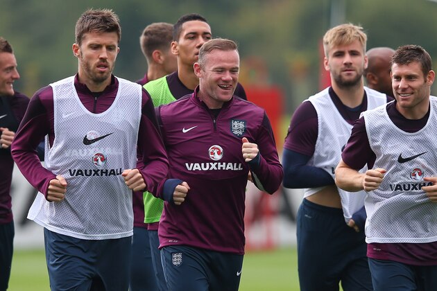 BURTON-UPON-TRENT, ENGLAND - SEPTEMBER 02:  Michael Carrick, Wayne Rooney and James Milner of England warm up during a England training session at St Georges Park on September 2, 2015 in Burton-upon-Trent, England.  (Photo by Alex Livesey/Getty Images)