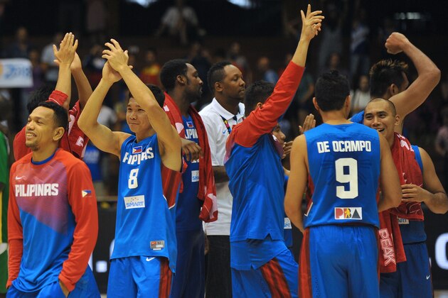 Philippines' players celebrate after winning the 2014 FIBA World basketball championships group B match Senegal vs Philippines at the Palacio Municipal de Deportes in Sevilla on September 4, 2014. Philippines won the match 81-79.  AFP PHOTO / CRISTINA QUICLER        (Photo credit should read CRISTINA QUICLER/AFP/Getty Images)