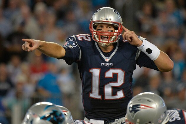 CHARLOTTE, NC - AUGUST 28:  Tom Brady #12 of the New England Patriots calls an audible against the Carolina Panthers during their preseason NFL game at Bank of America Stadium on August 28, 2015 in Charlotte, North Carolina.  (Photo by Grant Halverson/Getty Images)