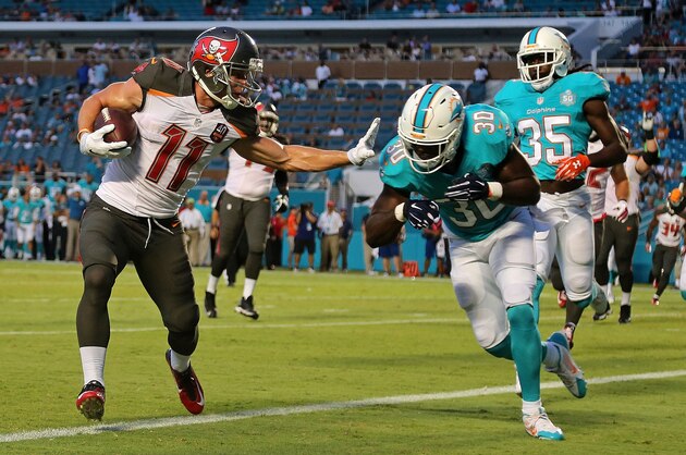 MIAMI GARDENS, FL - SEPTEMBER 03:  Adam Humphries #11 of the Tampa Bay Buccaneers scores a touchdown during a preseason game against the Miami Dolphins at Sun Life Stadium on September 3, 2015 in Miami Gardens, Florida.  (Photo by Mike Ehrmann/Getty Images)