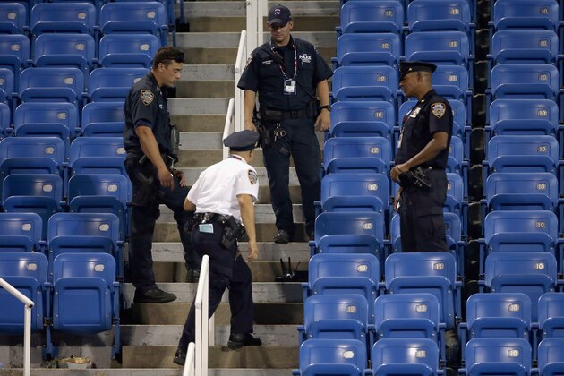 NEW YORK, NY - SEPTEMBER 03:  Police stand guard next to a drone after it crashed into the stands in Louis Armstrong Stadium during the during their Women's Singles Second Round match between  Flavia Pennetta of Italy and Monica Niculescu of Romania on Day Four of the 2015 US Open at the USTA Billie Jean King National Tennis Center on September 3, 2015 in the Flushing neighborhood of the Queens borough of New York City.  (Photo by Matthew Stockman/Getty Images)