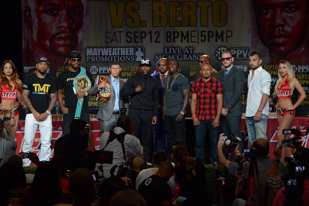Aug 6, 2015; Los Angeles, CA, USA; Fighters Ishe Smith, Badou Jack, Roman Martinez, Floyd Mayweather, Jr., Andre Berto fOrlando SalidoGEorge Groves and Vanes Martirosyan stand on the stage during a press conference to announce the upcoming fight on September 12, 2015 at J.W. Marriott LA Live. Mandatory Credit: Jayne Kamin-Oncea-USA TODAY Sports