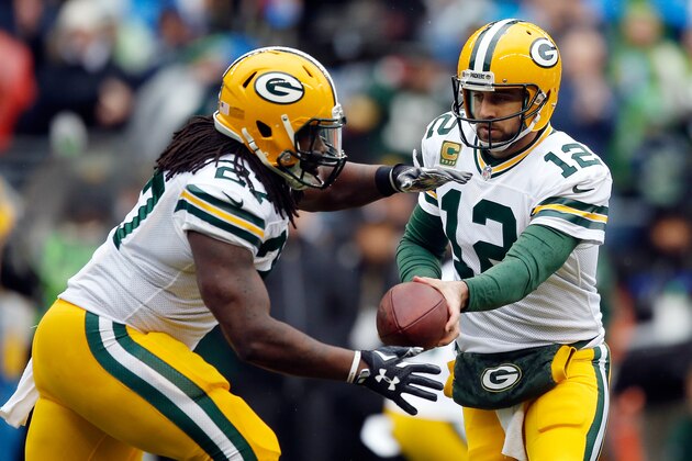 SEATTLE, WA - JANUARY 18:  Aaron Rodgers #12 hands the ball off to  Eddie Lacy #27 of the Green Bay Packers against the Seattle Seahawks during the 2015 NFC Championship game at CenturyLink Field on January 18, 2015 in Seattle, Washington.  (Photo by Otto Greule Jr/Getty Images)