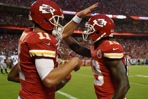 Aug 21, 2015; Kansas City, MO, USA; Kansas City Chiefs wide receiver Jeremy Maclin (19) celebrates with quarterback Alex Smith (11) after catching a touchdown pass against the Seattle Seahawks in the first half at Arrowhead Stadium. Mandatory Credit: John Rieger-USA TODAY Sports