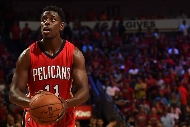 NEW ORLEANS, LA - APRIL 15:  Jrue Holiday #11 of the New Orleans Pelicans shoots a free throw during a game against the San Antonio Spurs at the Smoothie King Center on April 15, 2015 in New Orleans, Louisiana. NOTE TO USER: User expressly acknowledges and agrees that, by downloading and or using this photograph, User is consenting to the terms and conditions of the Getty Images License Agreement.  (Photo by Stacy Revere/Getty Images)