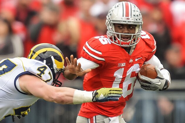 COLUMBUS, OH - NOVEMBER 29: Quarterback J.T. Barrett #16 of the Ohio State Buckeyes runs with the ball against the Michigan Wolverines at Ohio Stadium on November 29, 2014 in Columbus, Ohio. Ohio State defeated Michigan 42-28. (Photo by Jamie Sabau/Getty Images) COLUMBUS, OH - NOVEMBER 29: Quarterback J.T. Barrett #16 of the Ohio State Buckeyes runs with the ball against the Michigan Wolverines at Ohio Stadium on November 29, 2014 in Columbus, Ohio. Ohio State defeated Michigan 42-28. (Photo by Jamie Sabau/Getty Images)