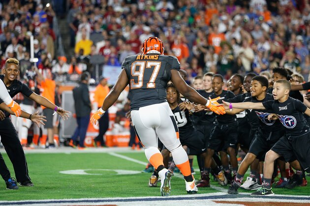 GLENDALE, AZ - JANUARY 25: Team Irvin defensive tackle Geno Atkins #97 of the Cincinnati Bengals high fives kids before the 2015 Pro Bowl at University of Phoenix Stadium on January 25, 2015 in Glendale, Arizona.  (Photo by Christian Petersen/Getty Images)
