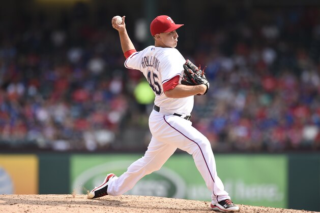 ARLINGTON, TX - AUGUST 30:  Derek Holland #45 of the Texas Rangers pitches against the Baltimore Orioles at Globe Life Park in Arlington on August 30, 2015 in Arlington, Texas.  The Texas Rangers defeated the Baltimore Orioles 6-0. (Photo by John Williamson/MLB Photos via Getty Images)