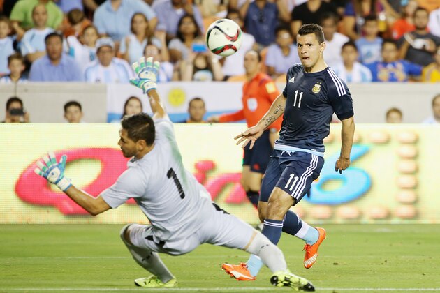 HOUSTON, TX - SEPTEMBER 04:  Sergio Aguero #11 of Argentina scores a goal past Dainel Vaca #1 of Bolivia during their international friendly match at BBVA Compass Stadium on September 4, 2015 in Houston, Texas.  (Photo by Scott Halleran/Getty Images)