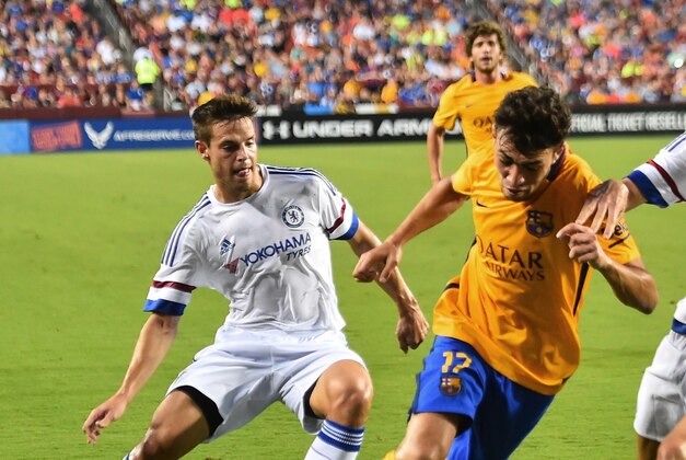 Barcelona's Munir El Haddadi (C) vies with Chelsea's Cesar Azpilicueta (L) and Gary Cahill during an International Champions Cup football match in Landover, Maryland, on July 28, 2015.    AFP PHOTO/NICHOLAS KAMM        (Photo credit should read NICHOLAS KAMM/AFP/Getty Images)