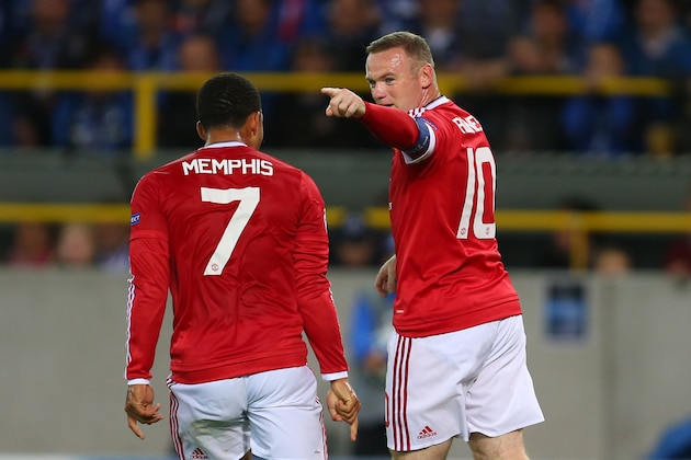 BRUGGE, BELGIUM - AUGUST 26: Wayne Rooney of Manchester United celebrates after he scores a goal to make it 0-1 with Memphis Depay of Manchester United during the UEFA Champions League Qualifying Round Play Off Second Leg between Club Brugge and Manchester United on August 26, 2015 in Brugge, Belgium. (Photo by Catherine Ivill - AMA/Getty Images)