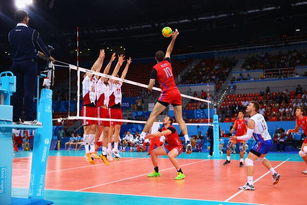 BAKU, AZERBAIJAN - JUNE 28:  Alexander Markin (10) of Russia is blocked at the next during the Men's bronze medal match between Poland and Russia on day sixteen of the Baku 2015 European Games at Crystal Hall on June 28, 2015 in Baku, Azerbaijan.  (Photo by Richard Heathcote/Getty Images for BEGOC)