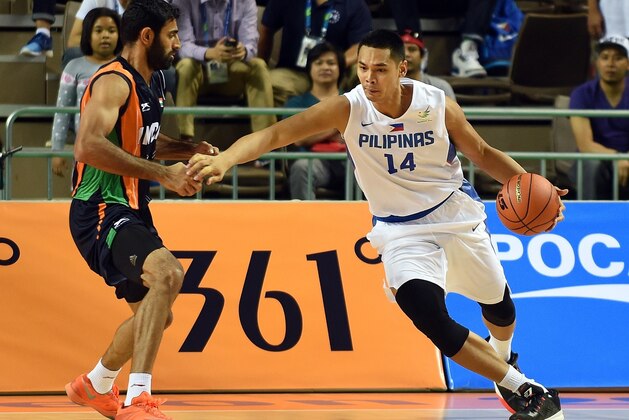 Japeth Paul Aguilar of the Philippines (R) dribbles the ball next to India's Yadwinder  Singh (L) in their men's basketball preliminary round group E match at the Hwaseong sports complex during the 2014 Asian Games in Incheon on September 23, 2014. AFP PHOTO / Prakash SINGH        (Photo credit should read PRAKASH SINGH/AFP/Getty Images)