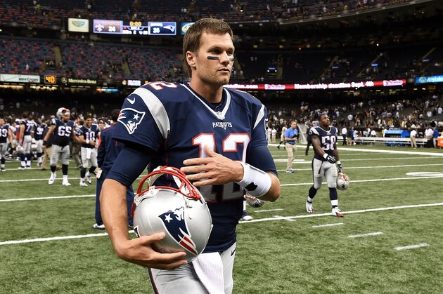 NEW ORLEANS, LA - AUGUST 22:  Tom Brady #12 of the New England Patriots leaves the field following a preseason game against the New Orleans Saints at the Mercedes-Benz Superdome on August 22, 2015 in New Orleans, Louisiana.  (Photo by Stacy Revere/Getty Images)