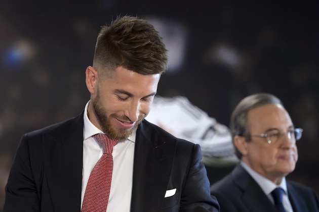 Real Madrid's defender and captain Sergio Ramos (L) and Real Madrid's president  Florentino Perez  stand during a press conference announcing Ramos' contract renewal in Madrid on August 17, 2015. Sergio Ramos will extend his contract with Real Madrid until 2020, announced today the Madrid club, ending weeks of speculation about the future of the iconic defender, promoted to team captain this season.  AFP PHOTO / DANI POZO        (Photo credit should read JAVIER SORIANO/AFP/Getty Images)