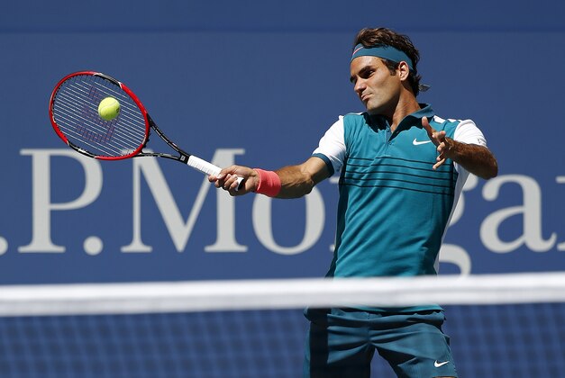 Sep 5, 2015; New York, NY, USA; Roger Federer of Swizterland hits a forehand against Philipp Kohlschreiber of Germany (not pictured) on day six of the 2015 U.S. Open tennis tournament at USTA Billie Jean King National Tennis Center. Mandatory Credit: Geoff Burke-USA TODAY Sports