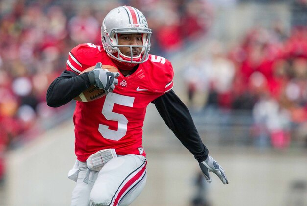 Nov 23, 2013; Columbus, OH, USA;  Ohio State Buckeyes quarterback Braxton Miller (5) runs the ball in the first quarter of the game against the Indiana Hoosiers at Ohio Stadium. Ohio State Buckeyes beat Indiana Hoosiers 42-14. Mandatory Credit: Trevor Ruszkowksi-USA TODAY Sports