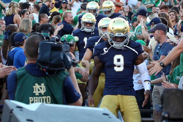 Sep 5, 2015; South Bend, IN, USA; Notre Dame Fighting Irish enter the stadium by walking through the student section before the game against the Texas Longhorns at Notre Dame Stadium. Mandatory Credit: Brian Spurlock-USA TODAY Sports