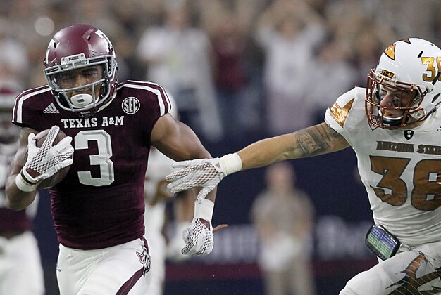Sep 5, 2015; Houston, TX, USA;  Texas A&M Aggies kick returner Christian Kirk (3) breaks the tackle of Arizona State Sun Devils linebacker Luke Williams (36) and returns the punt for a 79 yard touchdown in the second quarter at NRG Stadium. Mandatory Credit: Thomas B. Shea-USA TODAY Sports