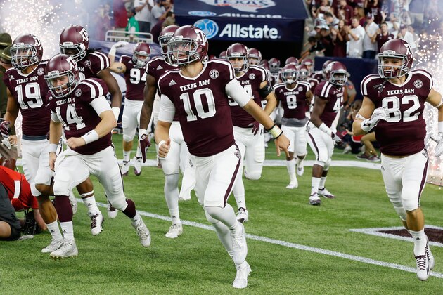 HOUSTON, TX - SEPTEMBER 05:  Kyle Allen #10 of the Texas A&M Aggies runs with his teammates onto the field before the start of their game against the Arizona State Sun Devils during the Advocare Texas Kickoff at NRG Stadium on September 5, 2015 in Houston, Texas.  (Photo by Scott Halleran/Getty Images)