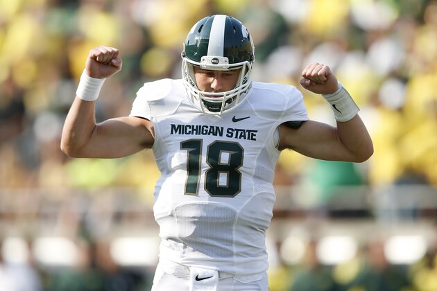 EUGENE, OR - SEPTEMBER 6: Connor Cook #18 of the Michigan State Spartans celebrates after a touchdown run by Jeremy Langford in the first half of the game against the Oregon Ducks at Autzen Stadium on September 6, 2014 in Eugene, Oregon. (Photo by Joe Robbins/Getty Images) EUGENE, OR - SEPTEMBER 6: Connor Cook #18 of the Michigan State Spartans celebrates after a touchdown run by Jeremy Langford in the first half of the game against the Oregon Ducks at Autzen Stadium on September 6, 2014 in Eugene, Oregon. (Photo by Joe Robbins/Getty Images)