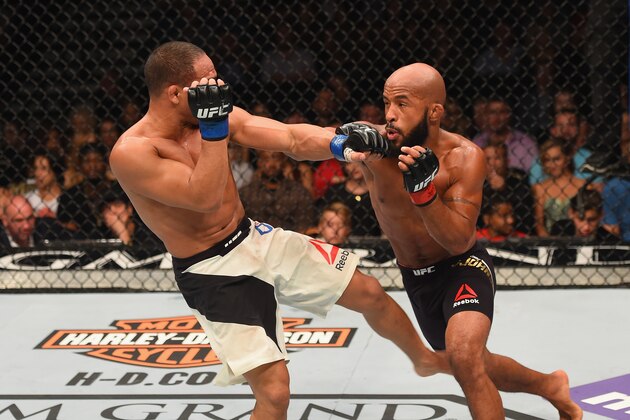 LAS VEGAS, NV - SEPTEMBER 05: (R-L) Demetrious Johnson punches John Dodson in their flyweight championship bout during the UFC 191 event inside MGM Grand Garden Arena on September 5, 2015 in Las Vegas, Nevada. (Photo by Josh Hedges/Zuffa LLC/Zuffa LLC via Getty Images) LAS VEGAS, NV - SEPTEMBER 05: (R-L) Demetrious Johnson punches John Dodson in their flyweight championship bout during the UFC 191 event inside MGM Grand Garden Arena on September 5, 2015 in Las Vegas, Nevada. (Photo by Josh Hedges/Zuffa LLC/Zuffa LLC via Getty Images)