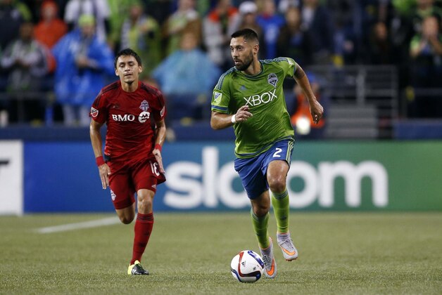 Sep 5, 2015; Seattle, WA, USA; Seattle Sounders FC forward Clint Dempsey (2) dribbles down the field ahead of Toronto FC midfielder Marky Delgado (18) during the first half at CenturyLink Field. Seattle won 2-1. Mandatory Credit: Jennifer Buchanan-USA TODAY Sports