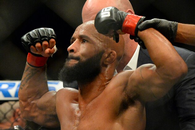 Sep 5, 2015; Las Vegas, NV, USA; Demetrious Johnson (red gloves) after defeating and John Dodson (not pictured) in the flyweight title bout at UFC 191 at MGM Grand Garden Arena. Johnson won the fight. Mandatory Credit: Jayne Kamin-Oncea-USA TODAY