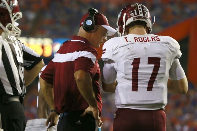 Sep 5, 2015; Gainesville, FL, USA; New Mexico State Aggies head coach Doug Martin talks with quarterback Tyler Rogers (17) against the Florida Gators during the second half at Ben Hill Griffin Stadium. Mandatory Credit: Kim Klement-USA TODAY Sports