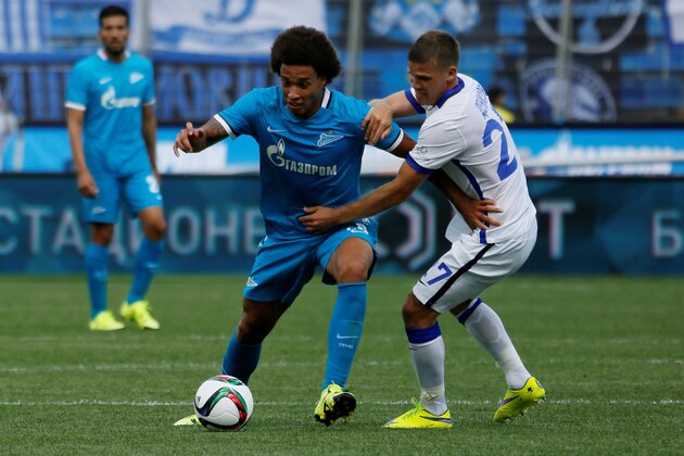 ST. PETERSBURG, RUSSIA - JULY 19: Axel Witsel (C) of FC Zenit St. Petersburg vies for the ball with Igor Denisov of FC Dinamo Moscow during the Russian Football League match between FC Zenit St. Petersburg and FC Dinamo Moscow at the Petrovsky stadium on July 19, 2015 in St. Petersburg, Russia. (Photo by Epsilon/Getty Images)