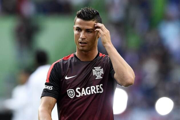 Portugal's forward Cristiano Ronaldo warms up before the Euro 2016 friendly football match Portugal vs France at the Jose Alvalade stadium in Lisbon on September 4, 2015.   AFP PHOTO/ FRANCK FIFE        (Photo credit should read FRANCK FIFE/AFP/Getty Images)