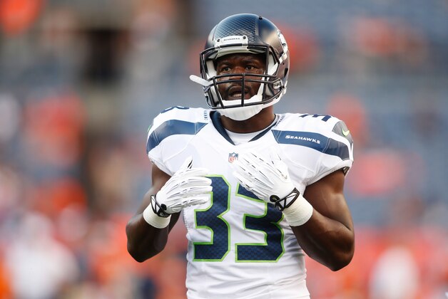 Aug 7, 2014; Denver, CO, USA; Seattle Seahawks running back Christine Michael (33) before the preseason game against the Denver Broncos at Sports Authority Field at Mile High. Mandatory Credit: Chris Humphreys-USA TODAY Sports
