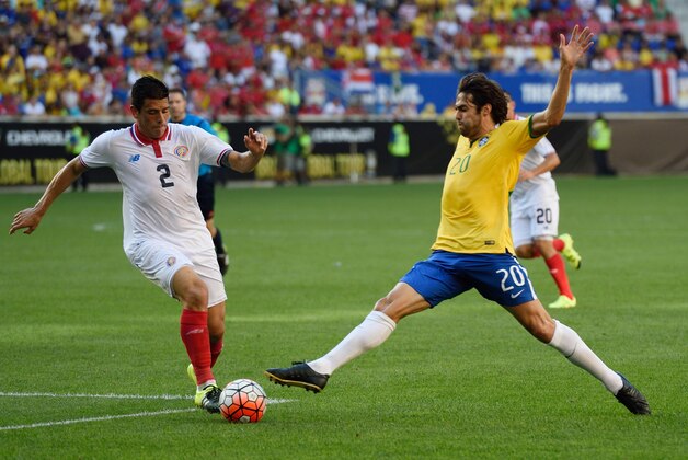Brazil's Kaka (R) controls the ball in front of Costa Rica's Johnny Acosta during the friendly match between Brazil and Costa Rica September 5, 2015 at Red Bulls Arena in Harrison, New Jersey. AFP PHOTO/DON EMMERT        (Photo credit should read DON EMMERT/AFP/Getty Images)