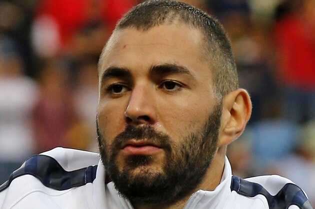 France's forward Karim Benzema listens to a national anthem before the Euro 2016 friendly football match Portugal vs France at the Jose Alvalade stadium in Lisbon on September 4, 2015.   AFP PHOTO/ JOSE MANUEL RIBEIRO        (Photo credit should read JOSE MANUEL RIBEIRO/AFP/Getty Images)