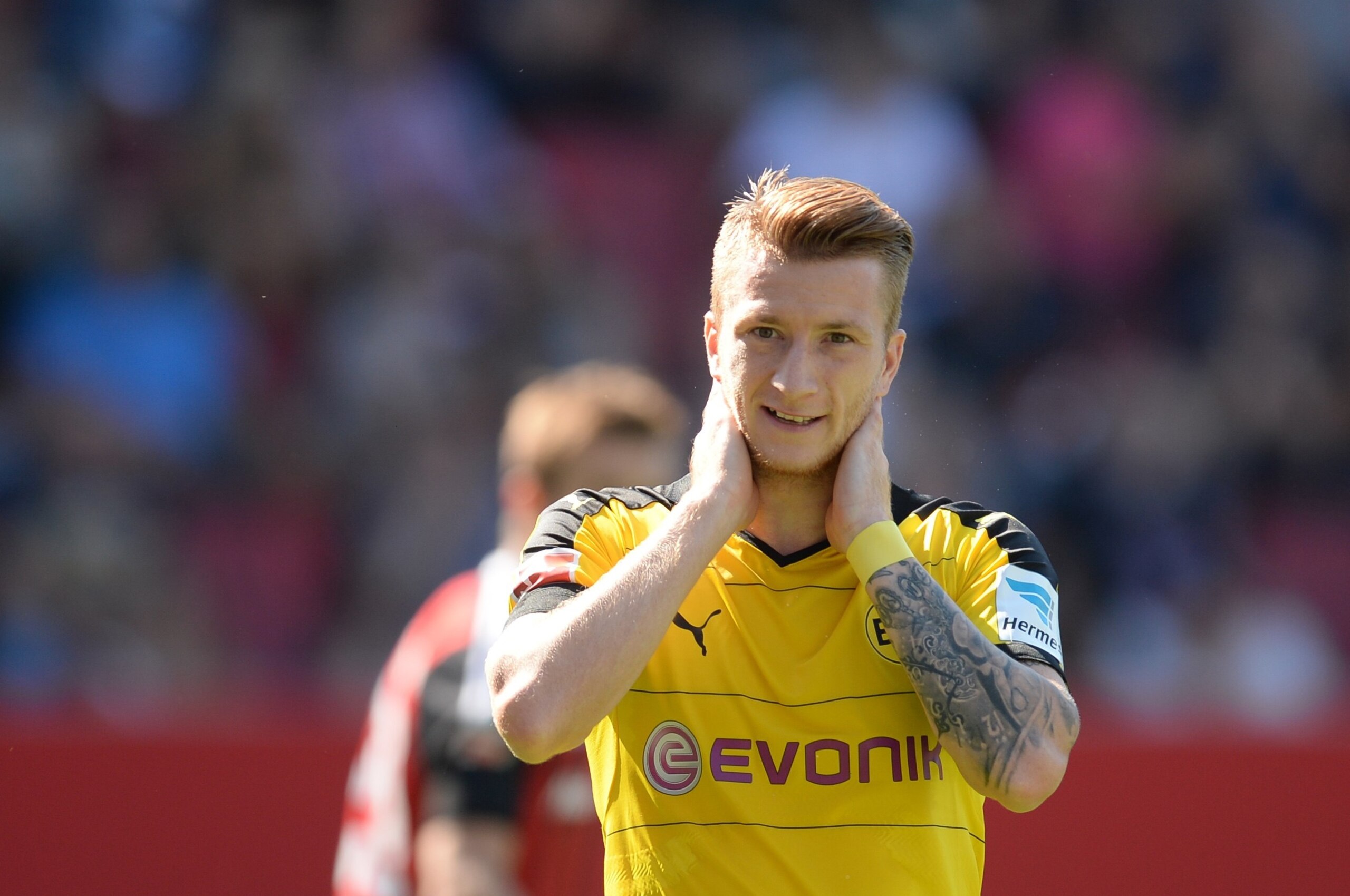 Dortmund's midfielder Marco Reus reacts during the German first division Bundesliga football match FC Ingolstadt 04 vs Borussia Dortmund, on August 23, 2015 in Ingolstadt, southern Germany.   AFP PHOTO / CHRISTOF STACHE

RESTRICTIONS: DURING MATCH TIME: DFL RULES TO LIMIT THE ONLINE USAGE TO 15 PICTURES PER MATCH AND FORBID IMAGE SEQUENCES TO SIMULATE VIDEO. 
== RESTRICTED TO EDITORIAL USE == FOR FURTHER QUERIES PLEASE CONTACT DFL DIRECTLY AT + 49 69 650050.        (Photo credit should read CHRISTOF STACHE/AFP/Getty Images)