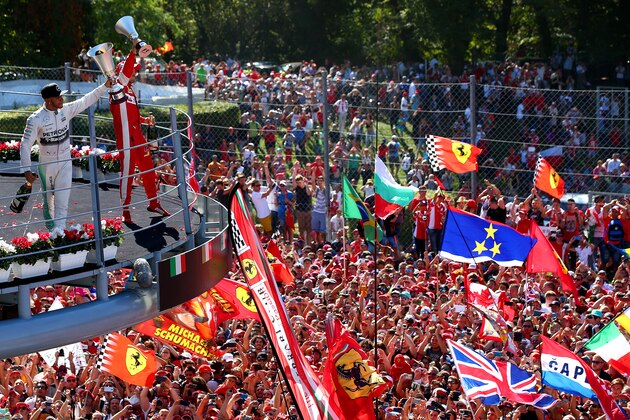 MONZA, ITALY - SEPTEMBER 06: Lewis Hamilton of Great Britain and Mercedes GP celebrates on the podium next to Sebastian Vettel of Germany and Ferrari after winning the Formula One Grand Prix of Italy at Autodromo di Monza on September 6, 2015 in Monza, Italy. (Photo by Mark Thompson/Getty Images) MONZA, ITALY - SEPTEMBER 06: Lewis Hamilton of Great Britain and Mercedes GP celebrates on the podium next to Sebastian Vettel of Germany and Ferrari after winning the Formula One Grand Prix of Italy at Autodromo di Monza on September 6, 2015 in Monza, Italy. (Photo by Mark Thompson/Getty Images)