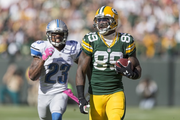GREEN BAY, WI - OCTOBER 6:  James Jones #89 of the Green Bay Packers runs during a 83 yard touchdown catch against the Chris Houston #23 of the Detroit Lions at Lambeau Field on October 6, 2013 in Green Bay, Wisconsin.  The Packers defeated the Lions 22-9.  (Photo Tom Lynn /Getty Images)