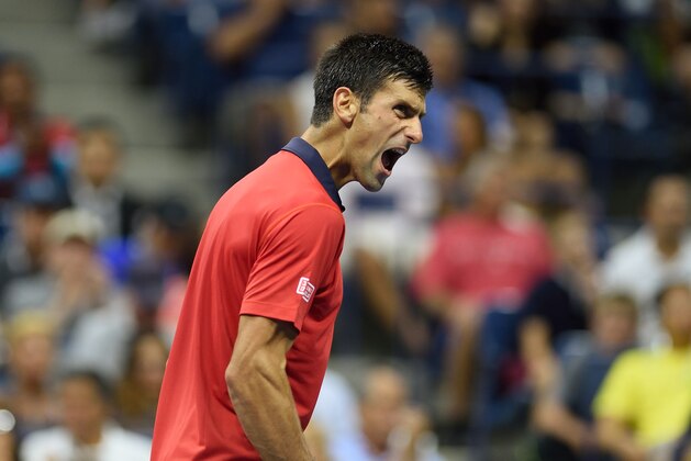 Novak Djokovic of Serbia reacts to a point while playing Roberto Bautista Agut from Spain  during their US Open 2015 fourth round men's singles match at the USTA Billie Jean King National Tennis Center on September 6, 2015  in New York. AFP PHOTO/DON EMMERT        (Photo credit should read DON EMMERT/AFP/Getty Images)