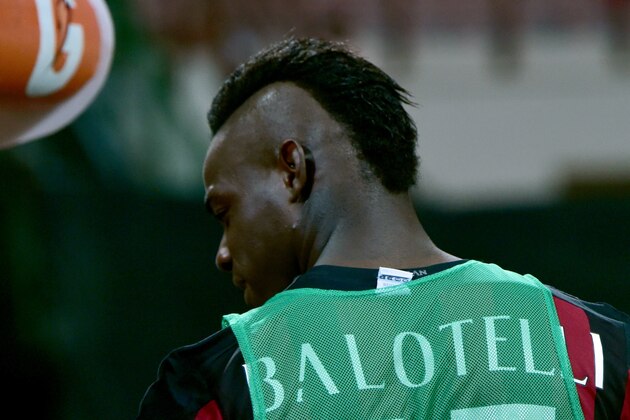 AC Milan's forward from Italy Mario Balotelli looks on before the Italian Serie A football match between AC Milan and Empoli  at San Siro Stadium in Milan on August 29, 2015. AFP PHOTO / GIUSEPPE CACACE        (Photo credit should read GIUSEPPE CACACE/AFP/Getty Images)