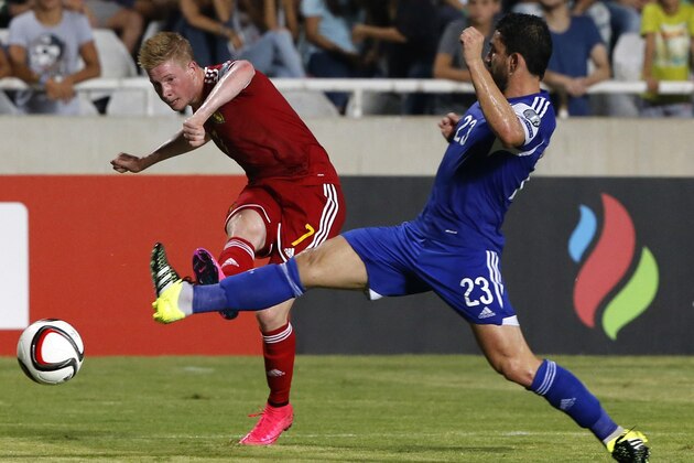 Belgium's Kevin De Bruyne (L) kicks the ball as Cyprus' Marios Nikolaou defends during their EURO 2016 qualifying football match between Cyprus and Belgium at the Neo GSP stadium in the Cypriot capital, Nicosia, on September 6, 2015. AFP PHOTO / FLORIAN CHOBLET (Photo credit should read FLORIAN CHOBLET/AFP/Getty Images) Belgium's Kevin De Bruyne (L) kicks the ball as Cyprus' Marios Nikolaou defends during their EURO 2016 qualifying football match between Cyprus and Belgium at the Neo GSP stadium in the Cypriot capital, Nicosia, on September 6, 2015. AFP PHOTO / FLORIAN CHOBLET (Photo credit should read FLORIAN CHOBLET/AFP/Getty Images)