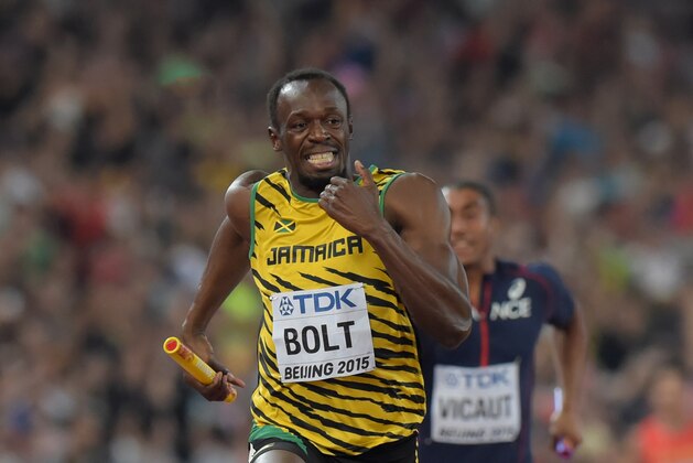 Aug 29, 2015; Beijing, China; Usain Bolt runs the anchor leg on the Jamaica 4 x 100m relay that won in 37.36 during the IAAF World Championships in Athletics at National Stadium. Mandatory Credit: Kirby Lee-USA TODAY Sports