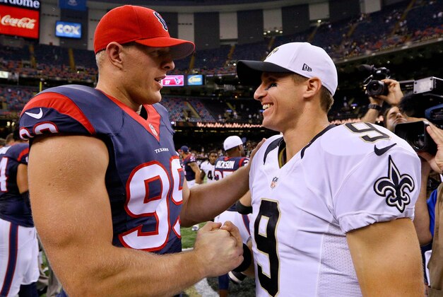 Aug 30, 2015; New Orleans, LA, USA; Houston Texans defensive end J.J. Watt (99) and New Orleans Saints quarterback Drew Brees (9) talk following a preseason game at the Mercedes-Benz Superdome. The Texans defeated the Saints 27-13. Mandatory Credit: Derick E. Hingle-USA TODAY Sports