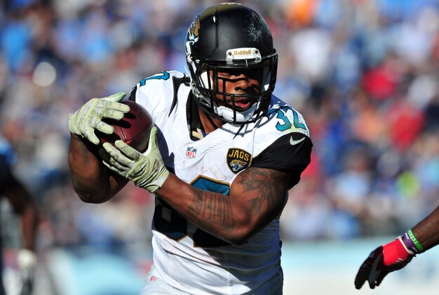 Nov 10, 2013; Nashville, TN, USA; Jacksonville Jaguars running back Maurice Jones-Drew (32) carries the ball against the Tennessee Titans during the first half at LP Field. The Jaguars beat the Titans 29-27. Mandatory Credit: Don McPeak-USA TODAY Sports
