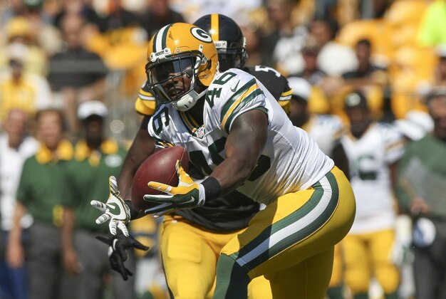 Aug 23, 2015; Pittsburgh, PA, USA; Green Bay Packers running back Alonzo Harris (46) drops the ball under pressure from Pittsburgh Steelers linebacker Terence Garvin (57) during the second half of the game at Heinz Field. The Steelers won the game, 24-19. Mandatory Credit: Jason Bridge-USA TODAY Sports